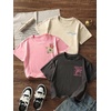 image:imageRoseSeek Girls 3 Packs Graphic Print T Shirts Set Crew Neck Short Sleeve T Shirt Oversized Summer TopsBeige Pink Blue